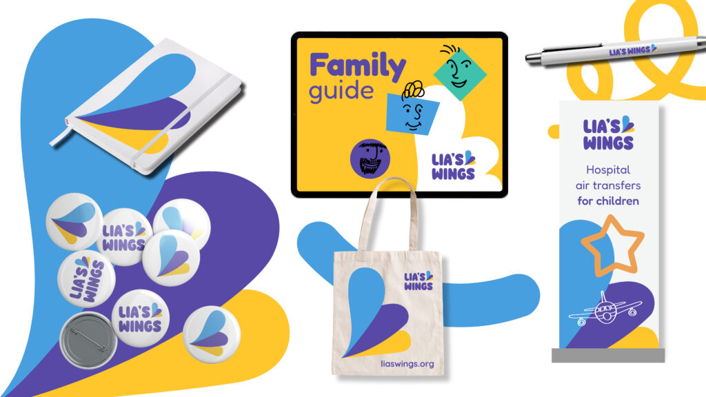 An image showing a tote bag and badges, a computer screen and pop-up banner all with the new blue, yellow nd purple brand in a curved abstract wing motif.